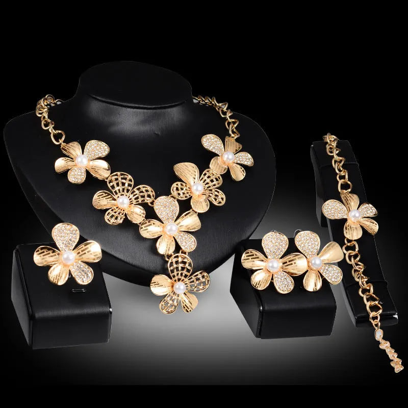 Gold alloy four-piece jewellery set with earrings, necklace, and bracelet in 18K colour, plant flower pattern