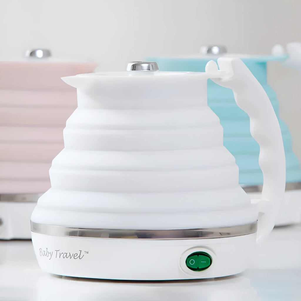 Foldable electric kettle in collapsed position showing compact 50mm height, silicone body, and power cord