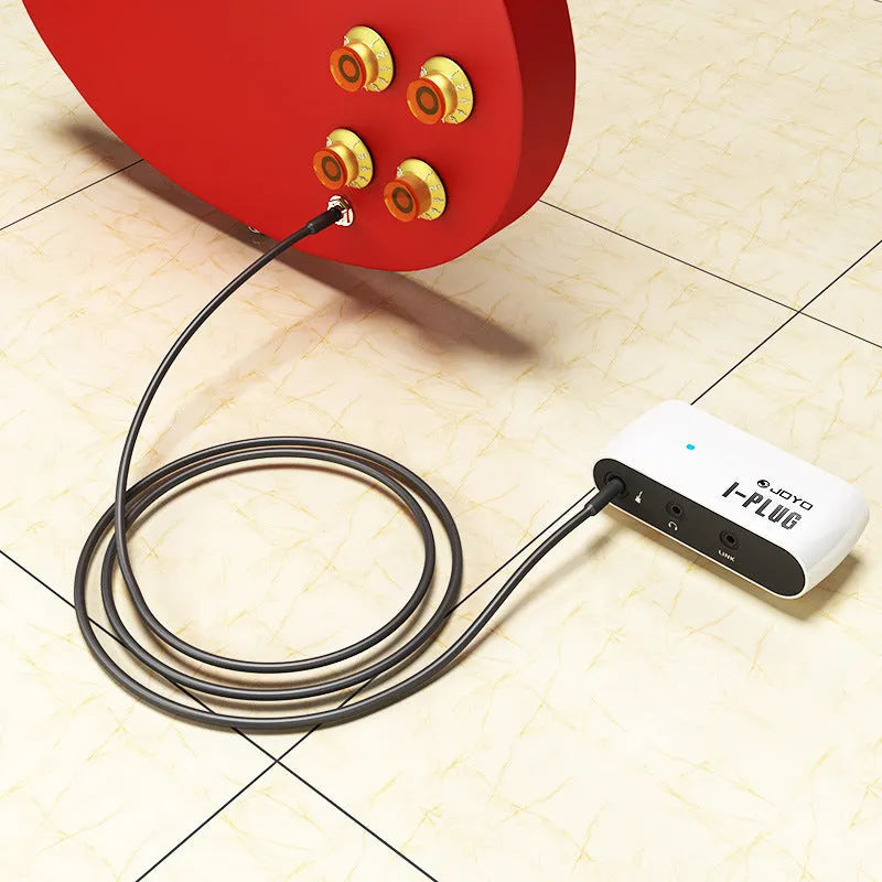 White multi-effects metal distortion headphone amplifier with battery compartment and connectors