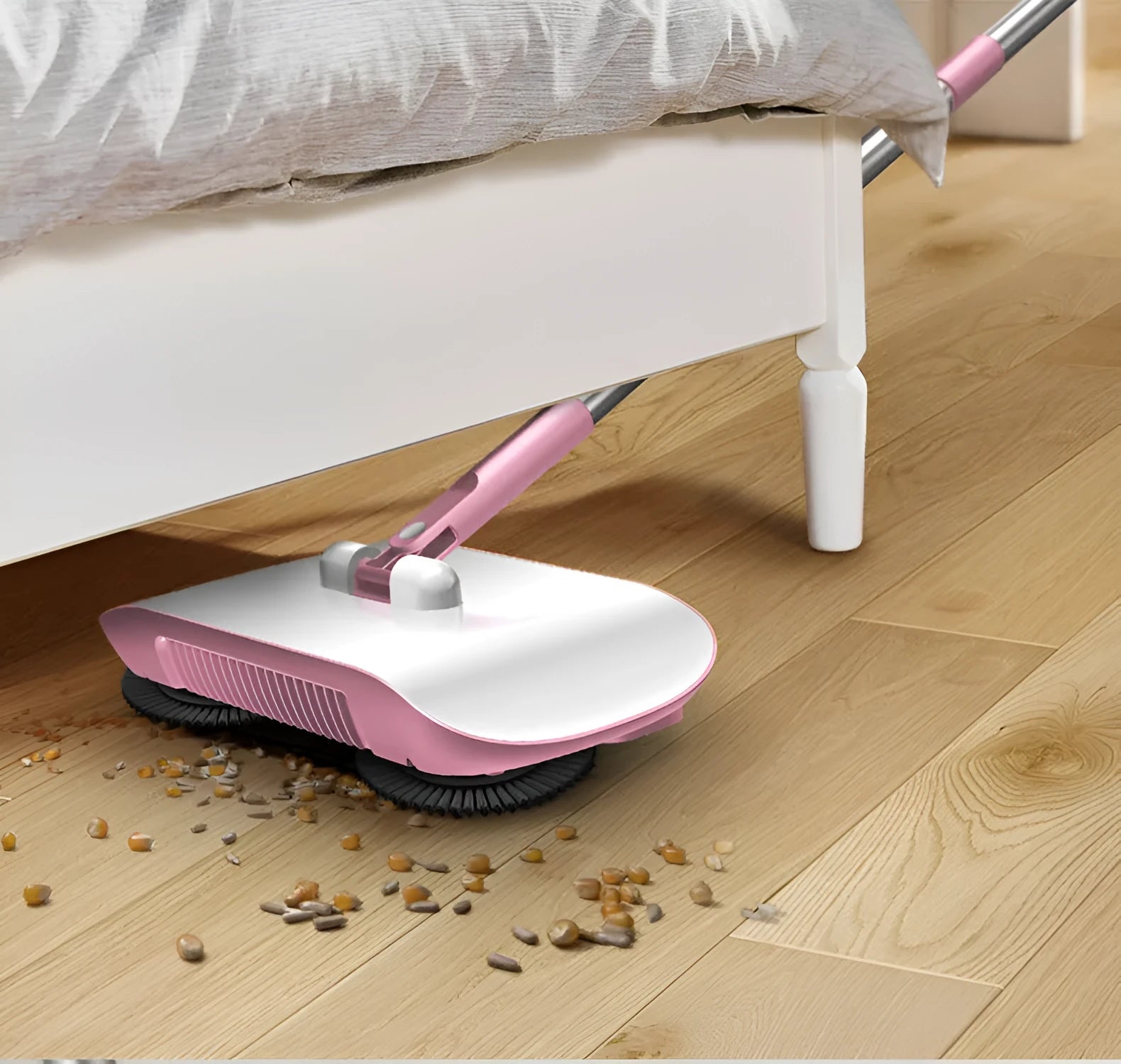 Pink hand push sweeper all-in-one broom dustpan mop with 360-degree brush on tile floor