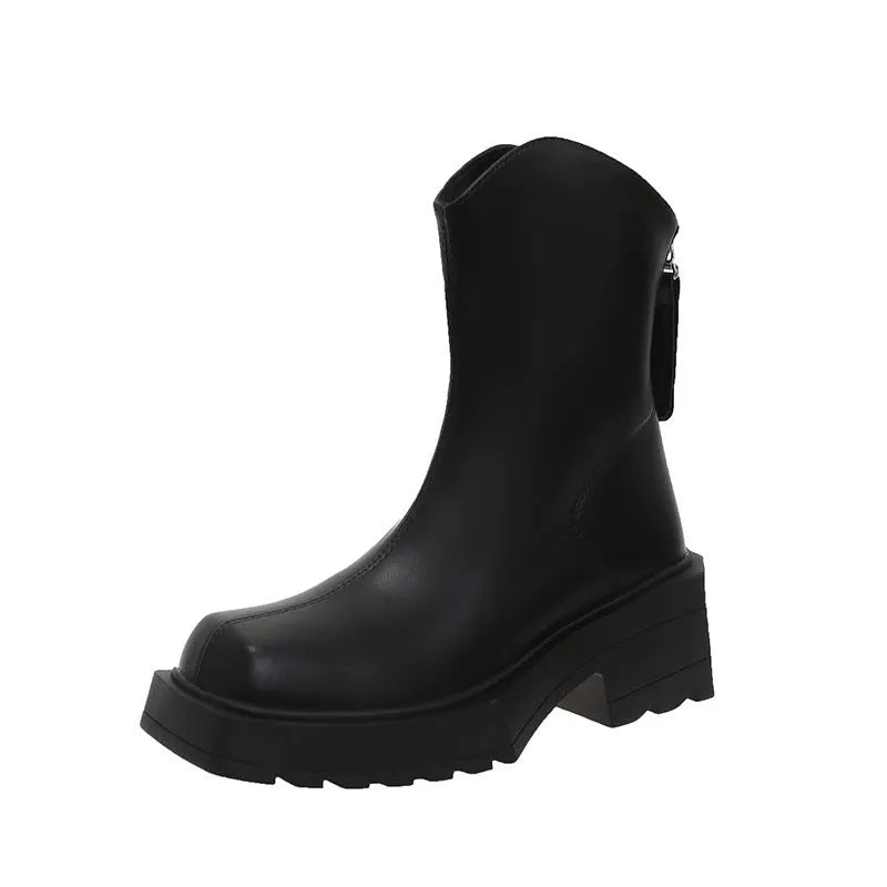 Women's black platform Martin boots with a square toe, chunky sole, and rear zip fastener