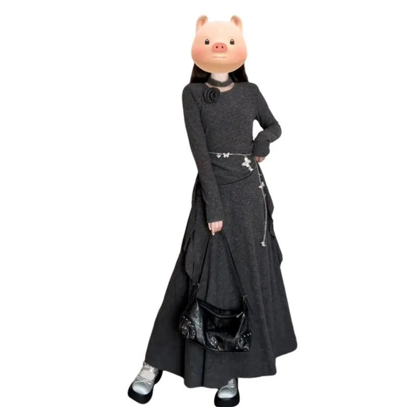 Women's gray knit dress set with neck-hanging top and long patchwork skirt on a model