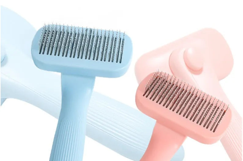 New Pet Needle Comb for dogs and cats, plastic construction, available in pink and blue, lightweight grooming brush