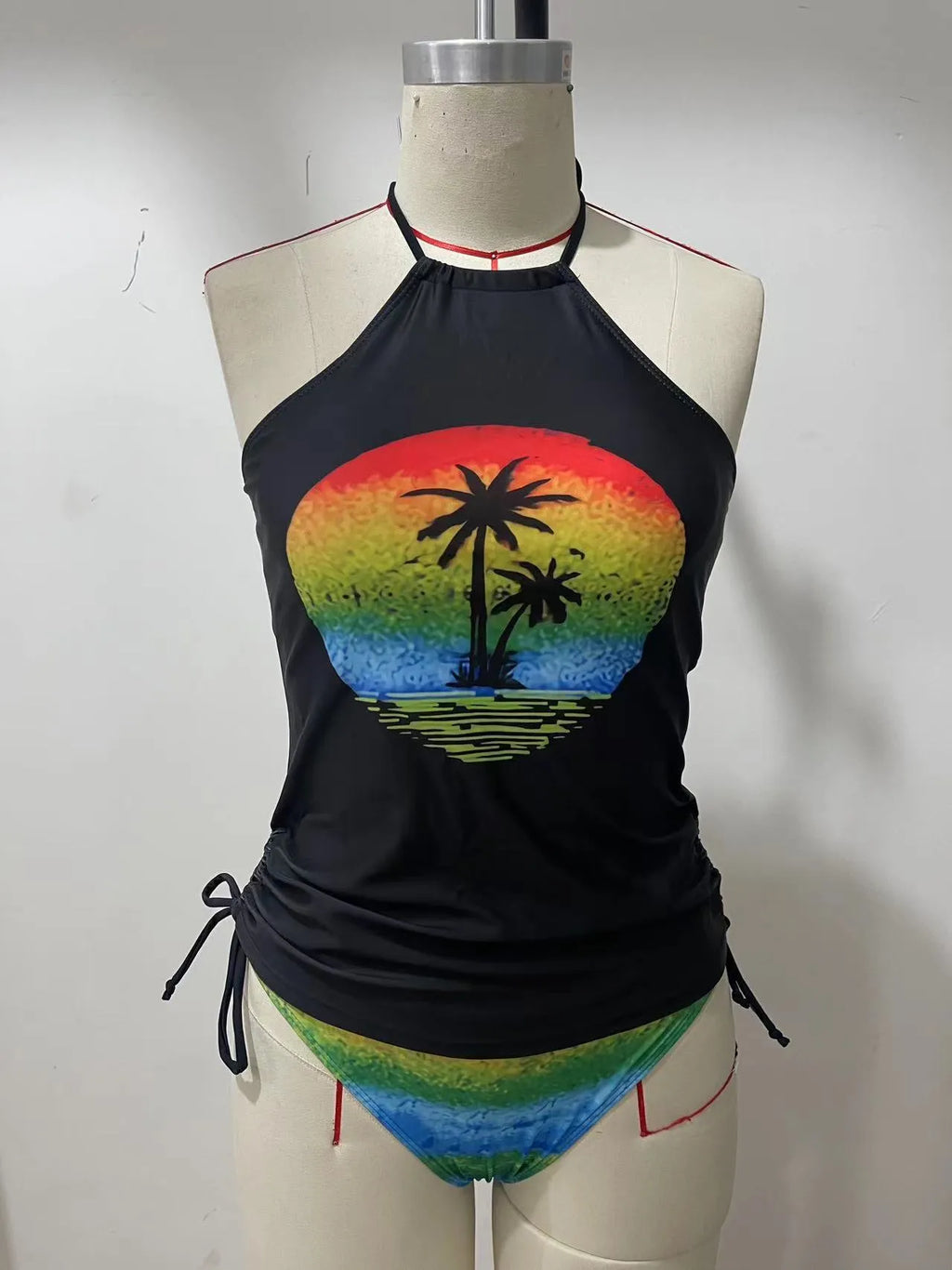 Women's conservative one-piece swimsuit with colourful split patterns and matching shorts