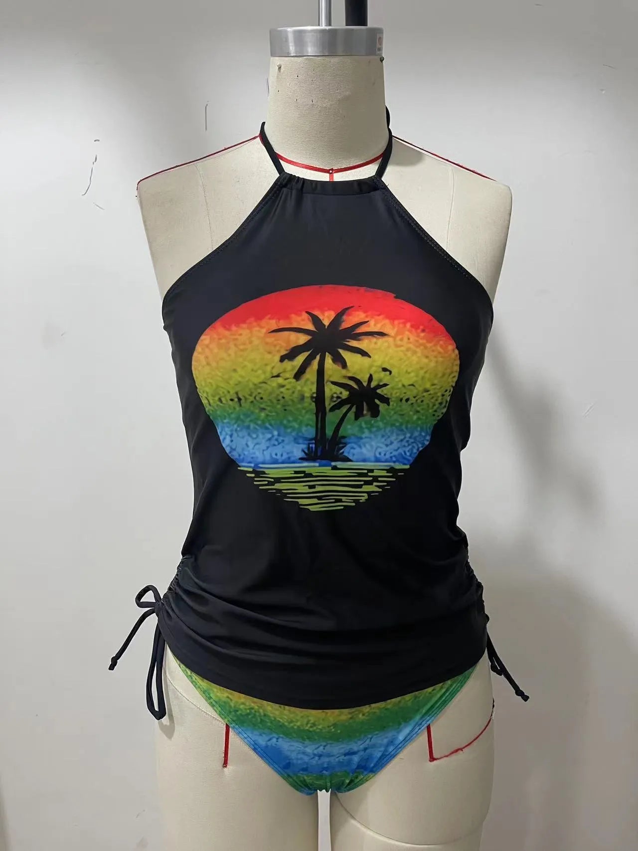 Women's conservative one-piece swimsuit with colourful split patterns and matching shorts