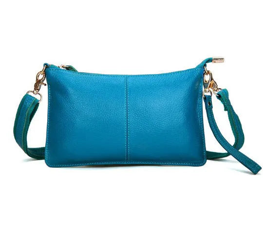 A cowhide lady slant bag in a chosen colour, showing hand and shoulder straps, with dimensions of 24 cm by 14 cm.