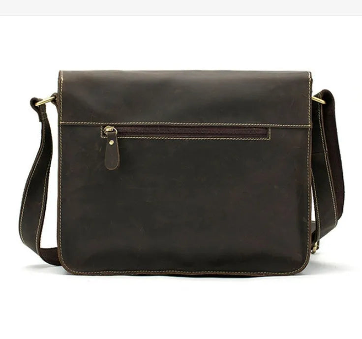 Brown full-grain leather vintage messenger bag with brass hardware, shown with strap adjusted