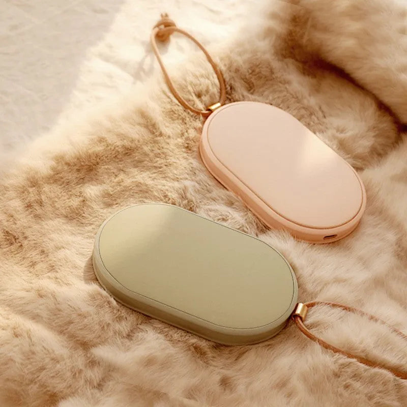 Rechargeable electric hand warmer in green with double-sided heating and 5000mAh power bank function