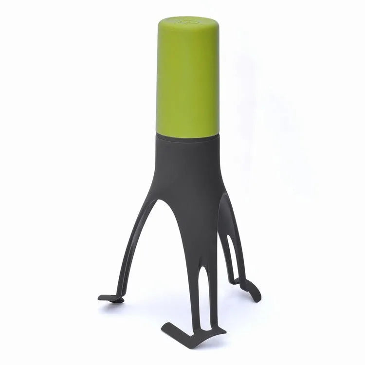 Uutensil Stirr automatic pot mixer device in green colour for hands-free stirring of sauces and soups.