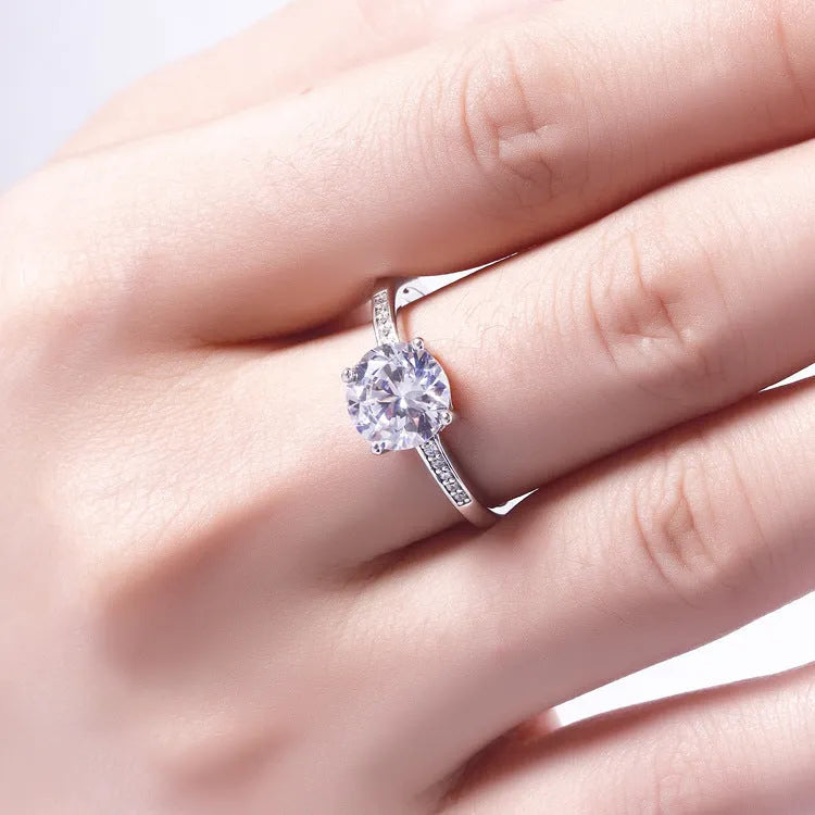 925 sterling silver engagement ring with 7.5mm main stone and small stones on white background