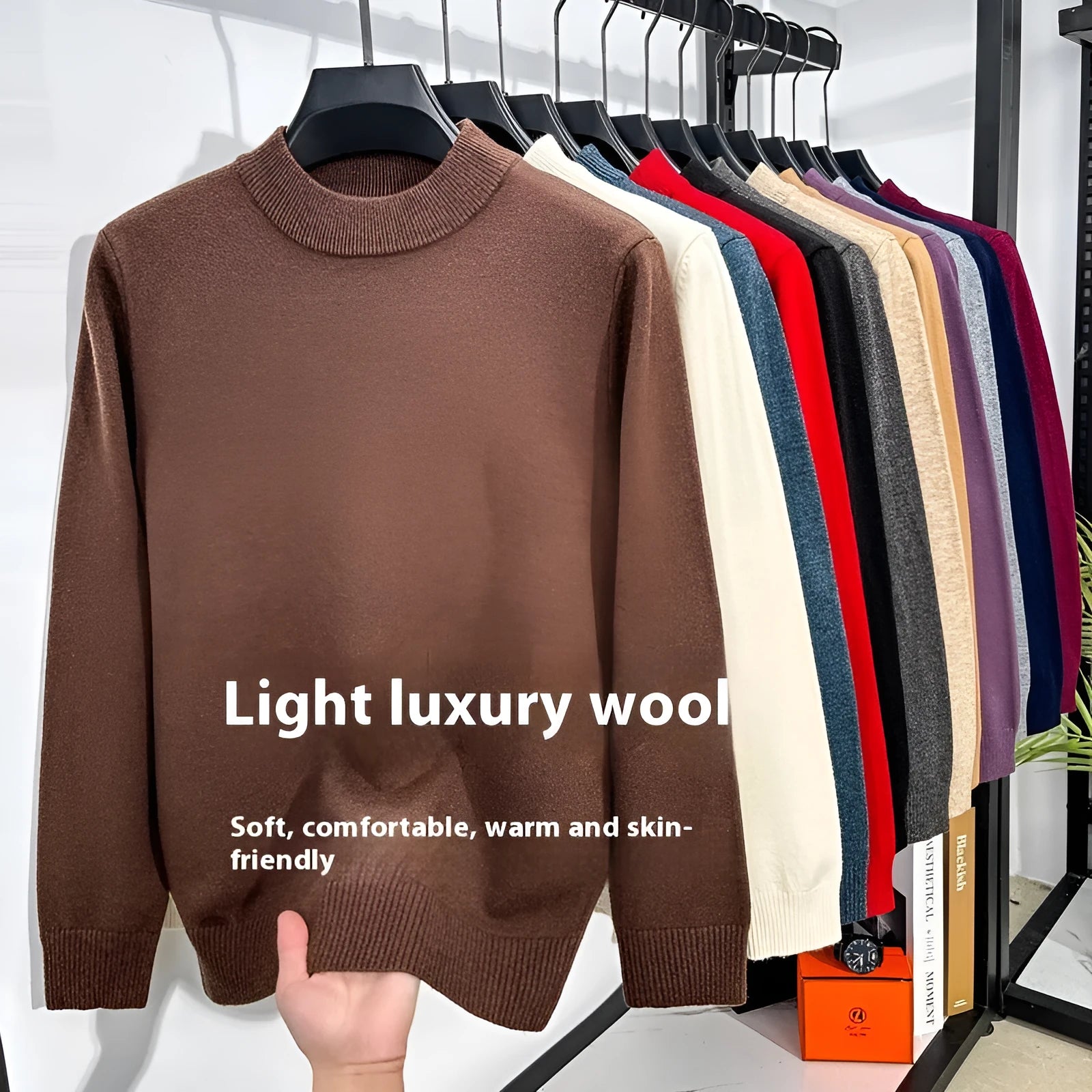 Men's fine yarn half turtleneck sweater in a solid colour on a hanger