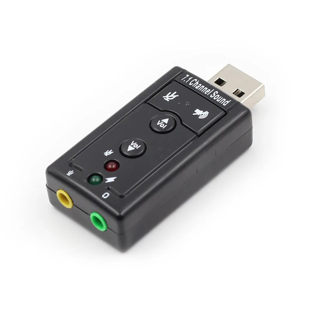 Black external USB sound card with 3.5mm headphone and mic jacks connected to a laptop