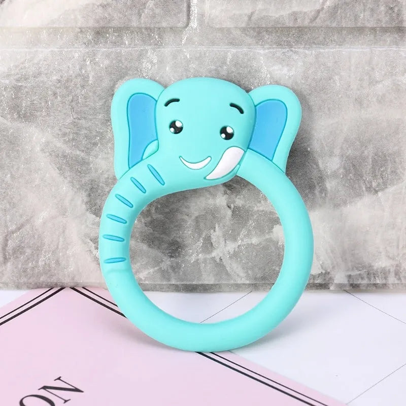 Three silicone baby molar teethers in brown, blue, and yellow on a white background