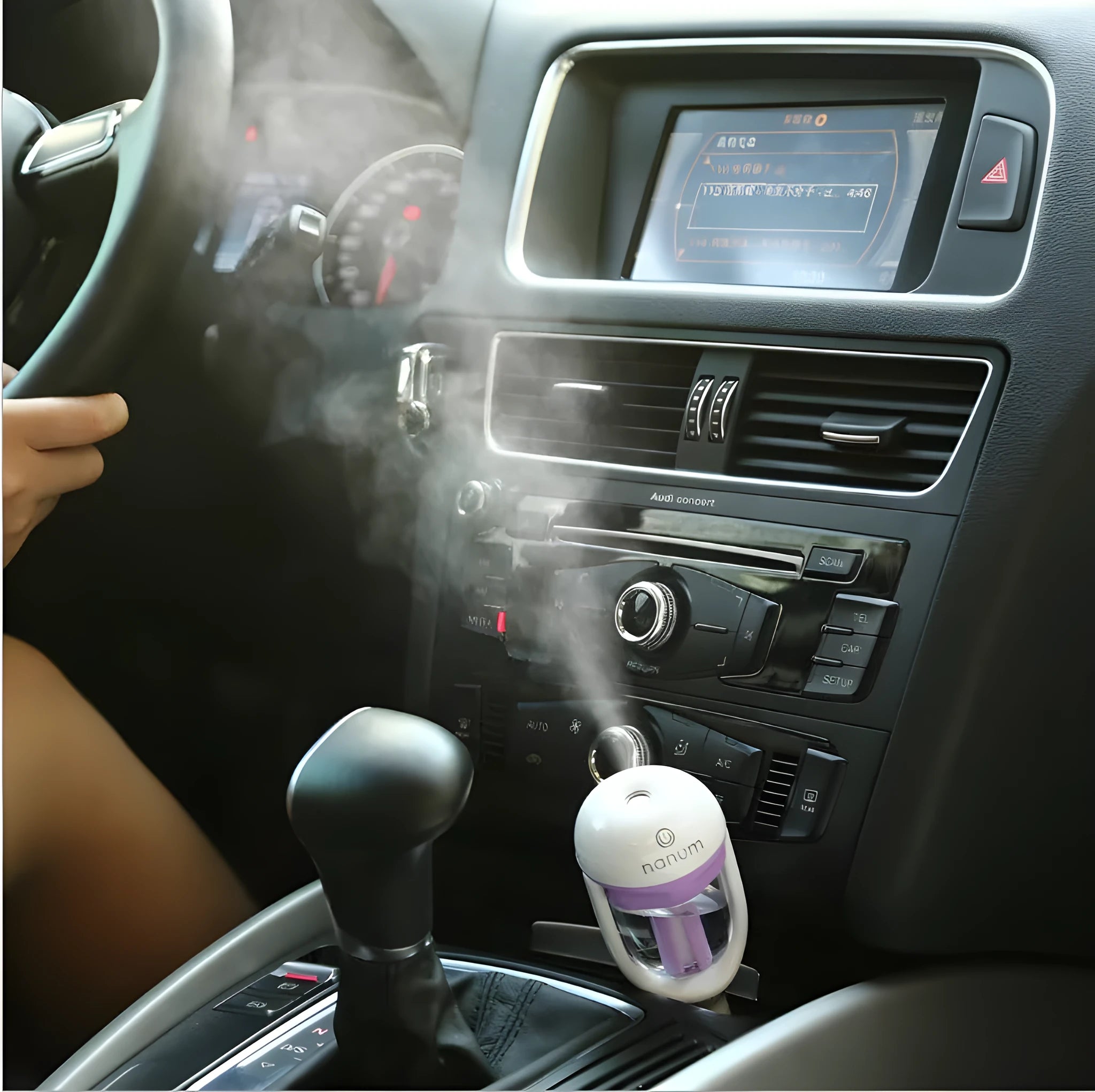 Compact blue car humidifier diffuser with mist output and rotation feature