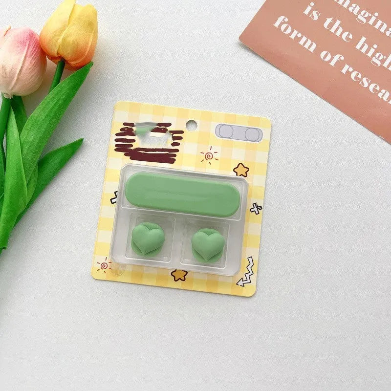 Plastic cartoon-style magnetic data cable fixer clip on a desktop