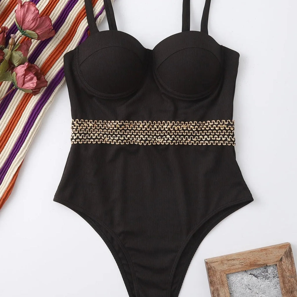 Black one-piece swimsuit for women with adjustable shoulder straps on a mannequin.