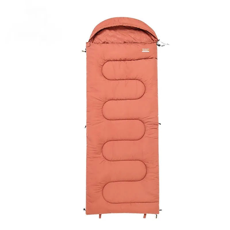 Portable ochre and olive green cotton sleeping bag quilt laid out flat, showing its quilted design for camping.