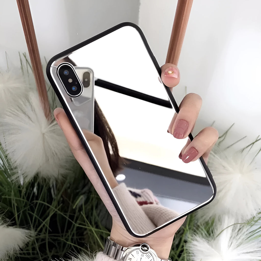 Black mirror back cover phone case for Apple iPhone X, 11, 12, 7, 8, and 6 models on a table.