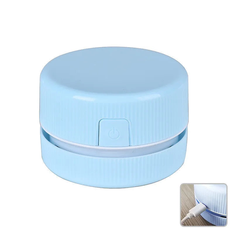 Mini handheld desktop vacuum cleaner in blue colour for pencil chip and soot removal
