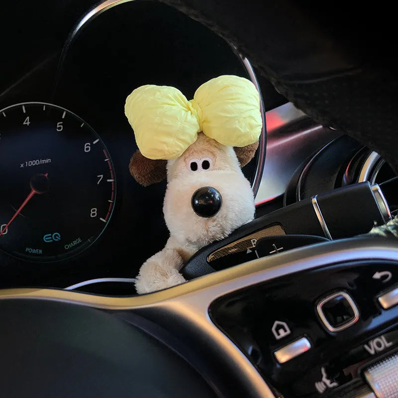 Cute cotton car decoration doll showing a pilot dog design on a dashboard.
