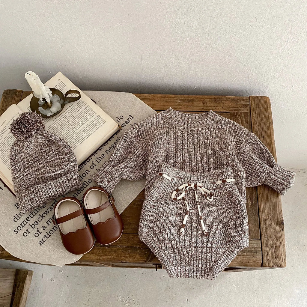 Dark brown baby girl three-piece clothing set with knitted hat, blouse and shorts