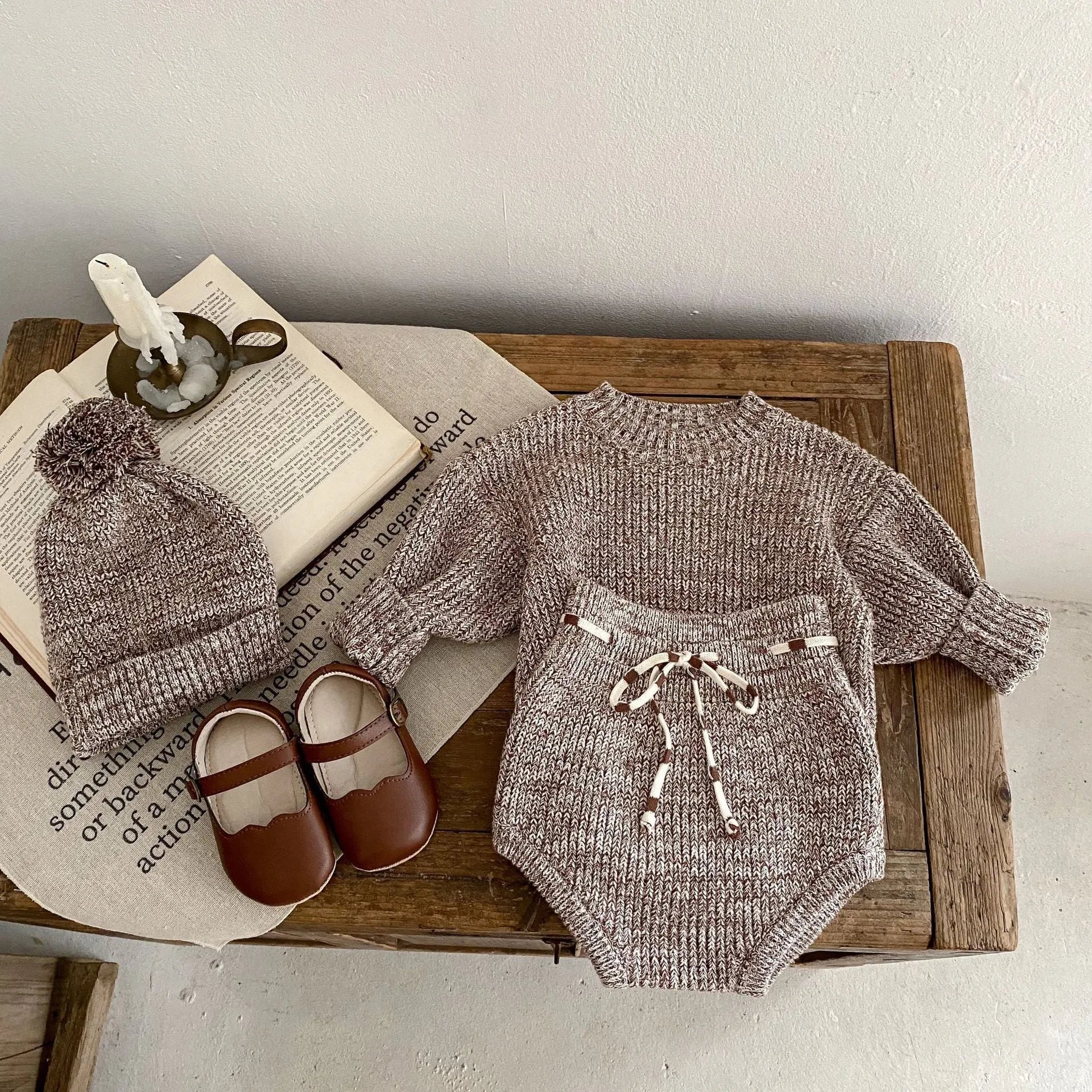 Dark brown baby girl three-piece clothing set with knitted hat, blouse and shorts