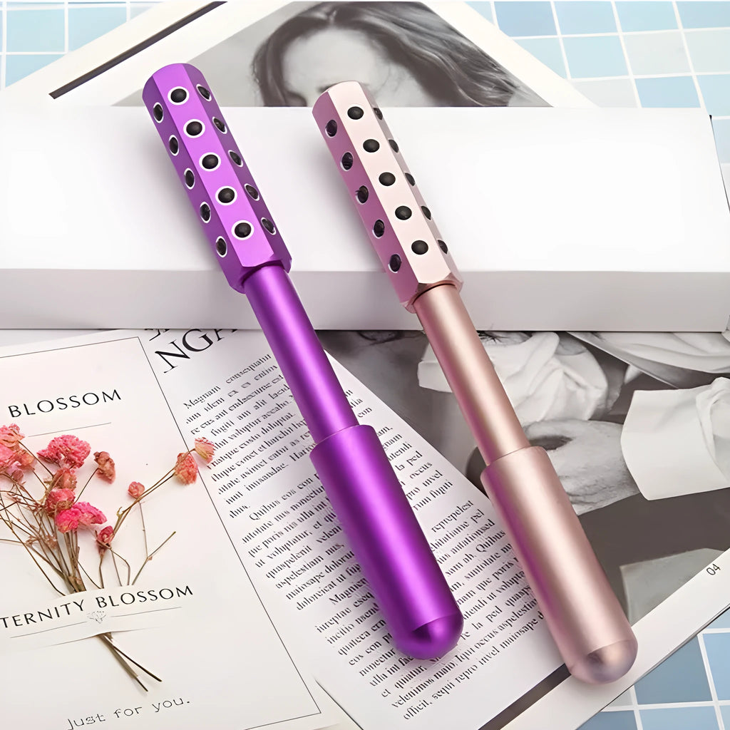 Purple Germanium particle handheld roller massager for face and eyes.