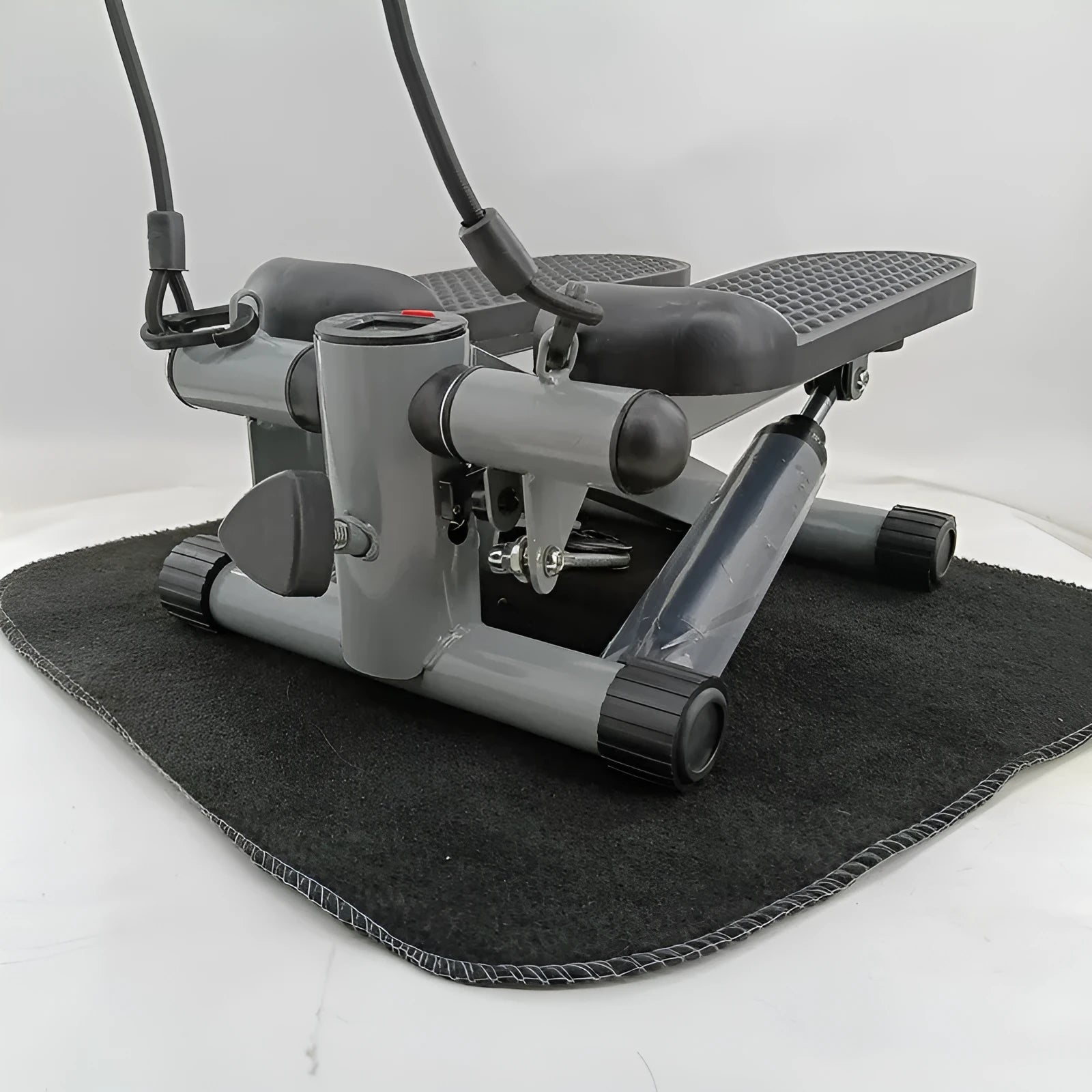 Silver grey hydraulic resistance exercise stepper machine for home fitness.