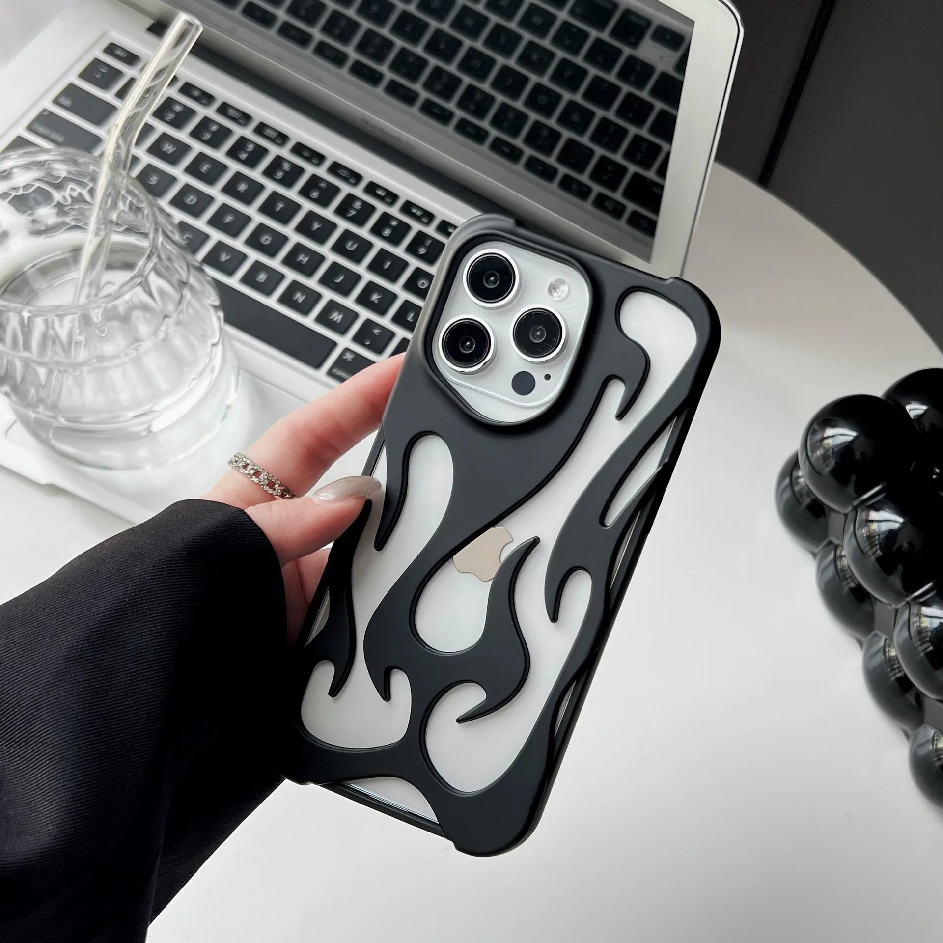 Electroplated hollow flame pattern soft TPU phone case for Apple iPhone, shown in silver on a dark background.
