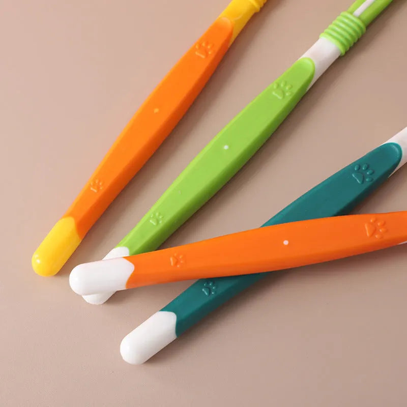 Pet toothbrush with angled handle and soft nylon bristles in multiple colour options for dog and cat dental care