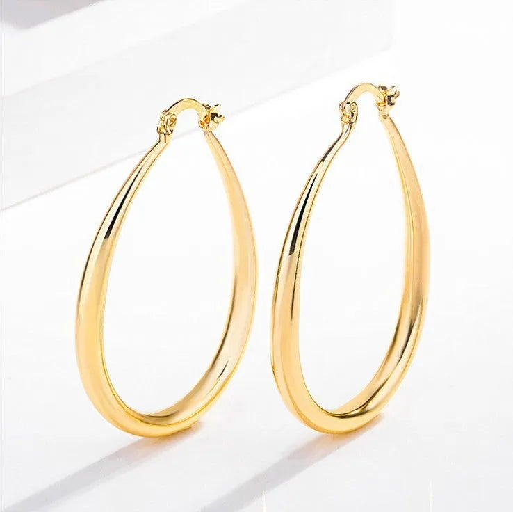 Geometric oval metal earrings for women with electroplated finish and alloy inlaid gems in gold and silver