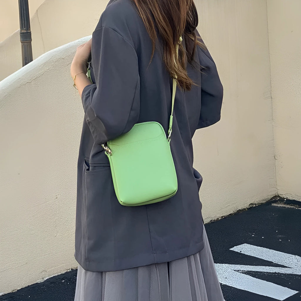 Solid colour PU leather crossbody phone bag for women in beige, showing front view.