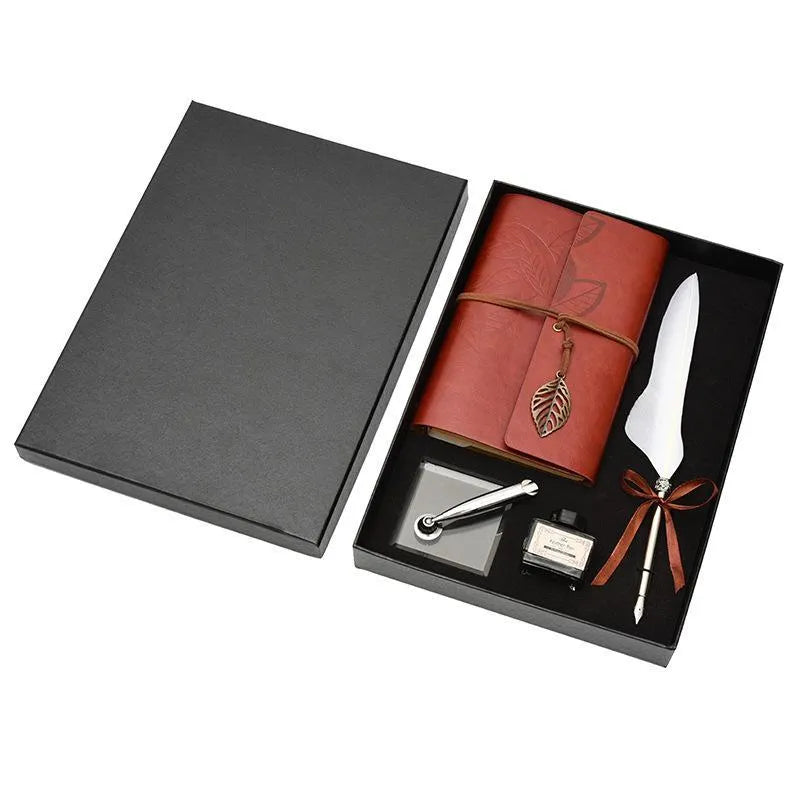Feather dip pen gift set with copper pen, ink bottle, acrylic base, and antique book in box