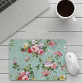 Thick custom cartoon mouse pad with colourful design on a desk, showing black seam edge