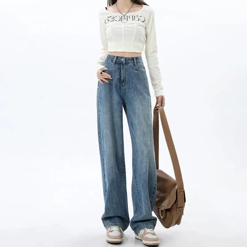 Woman wearing high-waisted retro blue wide-leg denim jeans with a straight cut.