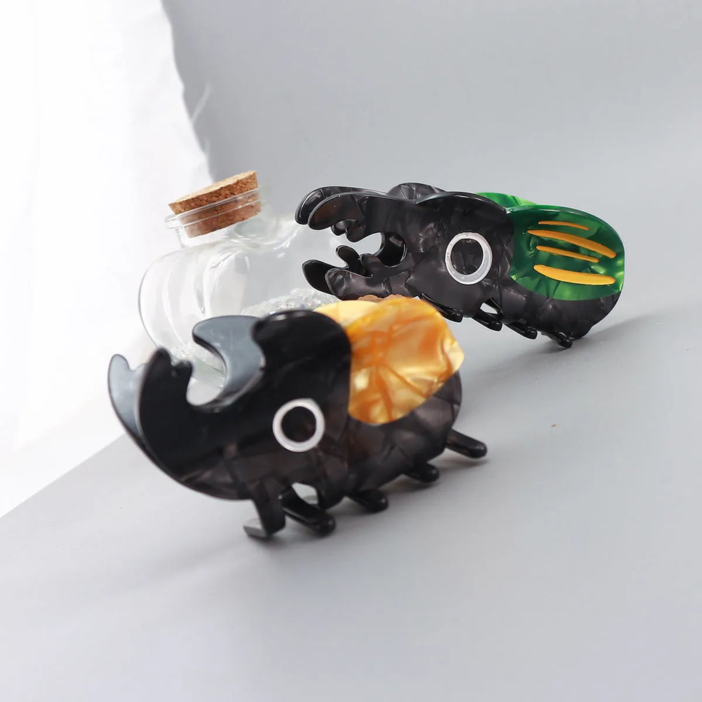 Handmade cellulose acetate beetle grip hair accessory with cartoon insect design