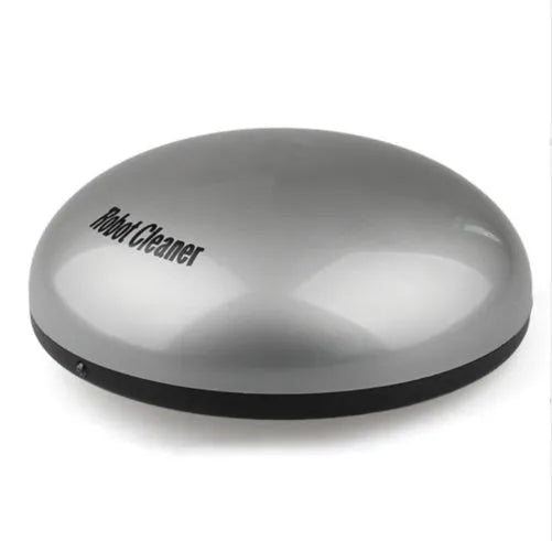 Compact silver automatic vacuum cleaner robot on a wooden floor