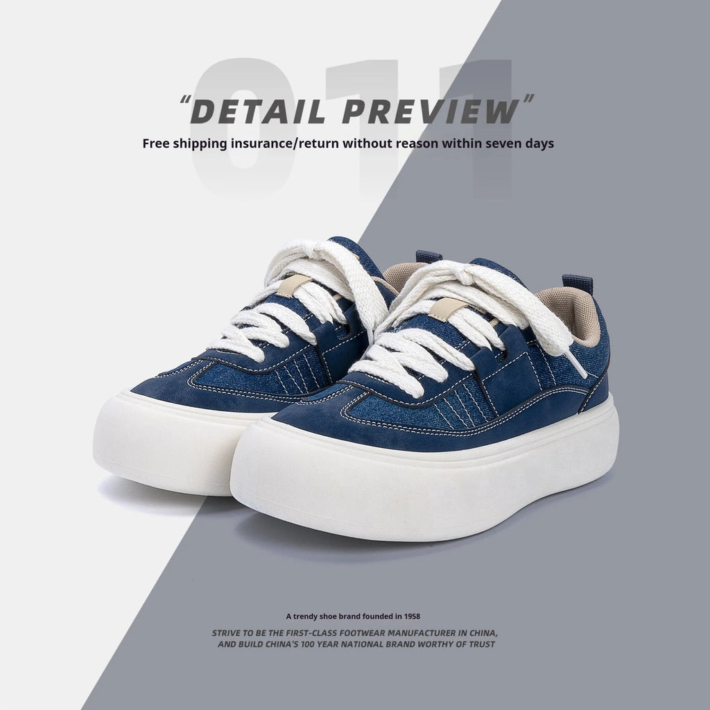Men's black canvas platform sneakers with round toe and lace-up front on grey background