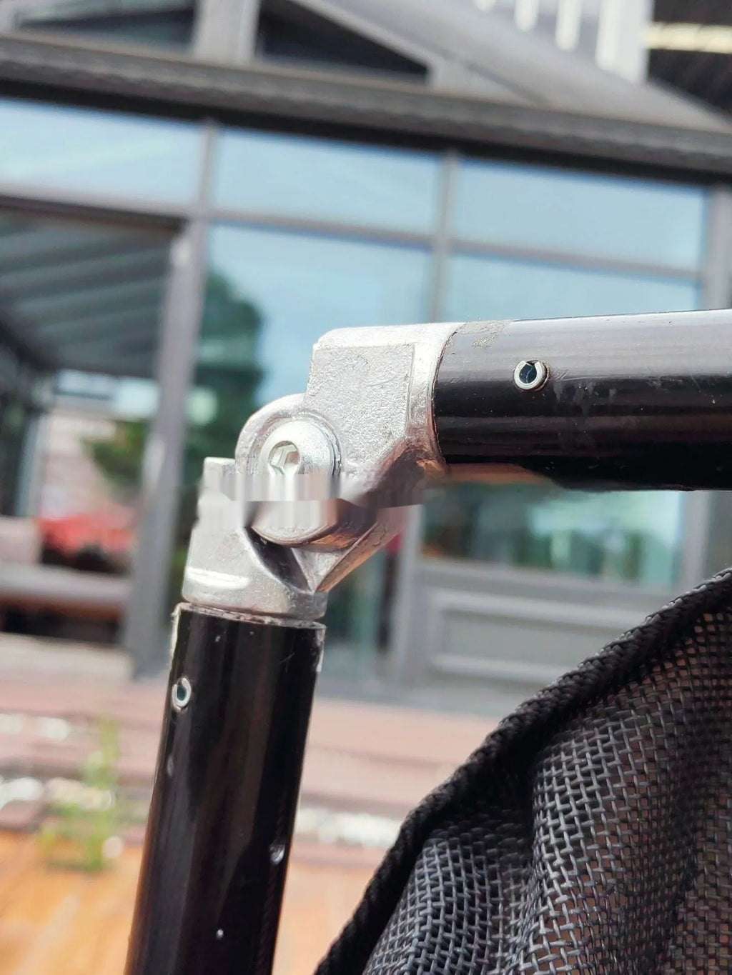 Black aluminium alloy folding pet stretcher for large dogs and emergency animal transfer.