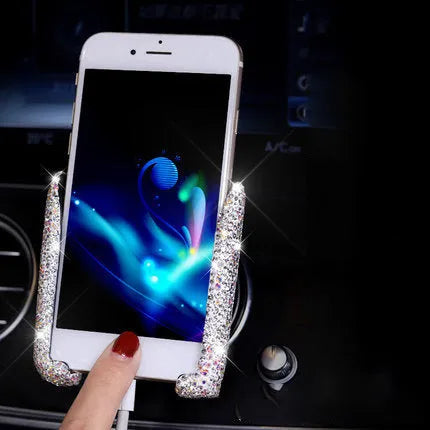 Car buckle mobile phone holder in ABS plastic on a car dashboard with a smartphone in place