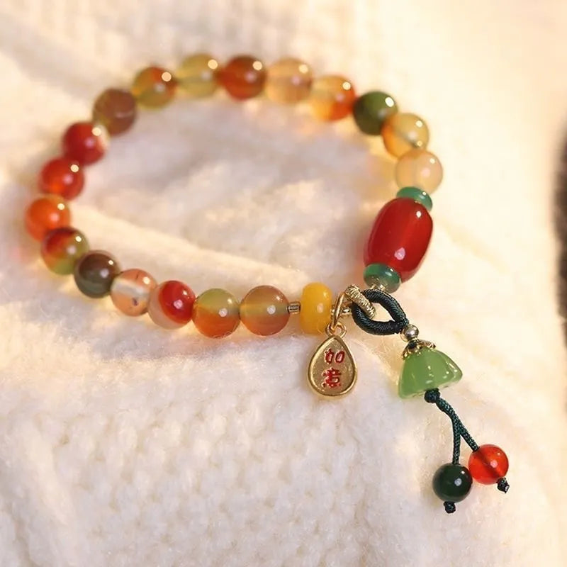 M990 Lotus Ruyi bracelet showing mixed material construction and lotus motif with manual craft details