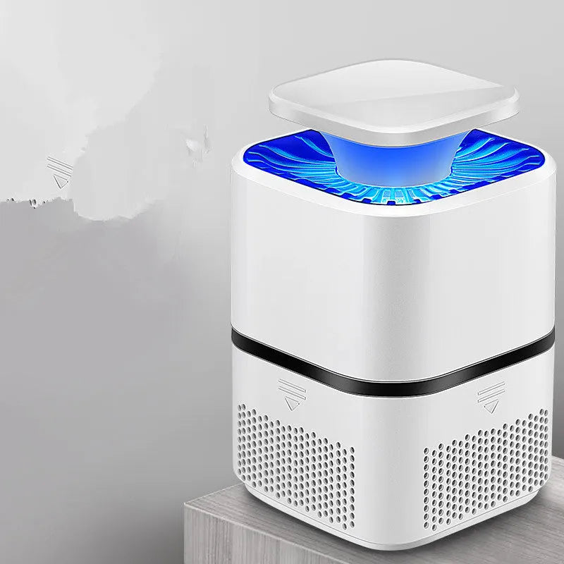 White ultimate version photocatalyst mosquito killer with blue light on a flat surface, USB cable attached