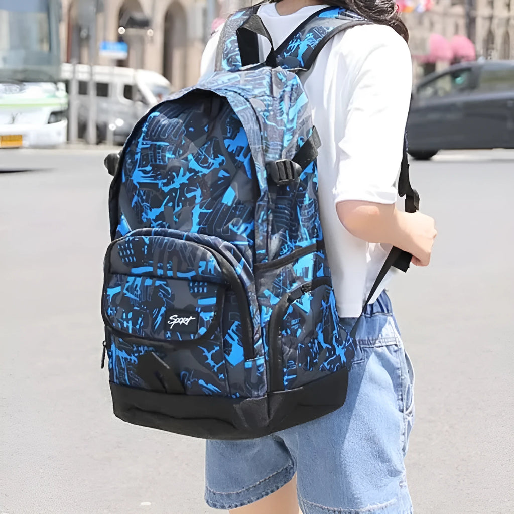 Blue classic nylon backpack with multiple pockets and adjustable padded straps, shown closed.