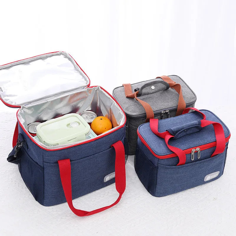 Grey insulated crossbody picnic bag with shoulder strap and 15 litre capacity.