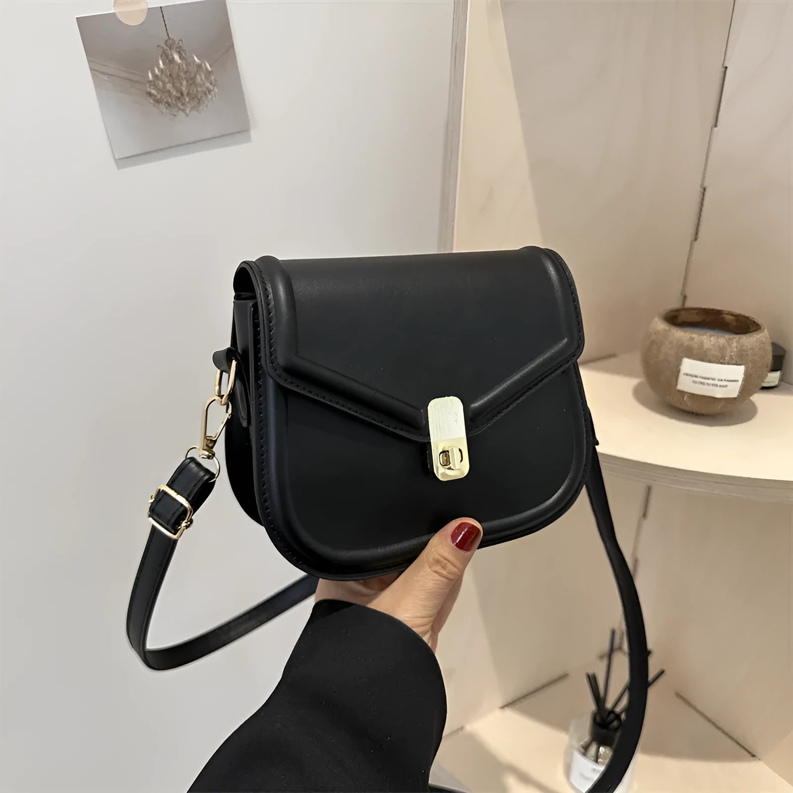 Soft PU clamshell messenger bag in horizontal square shape on a shoulder strap.