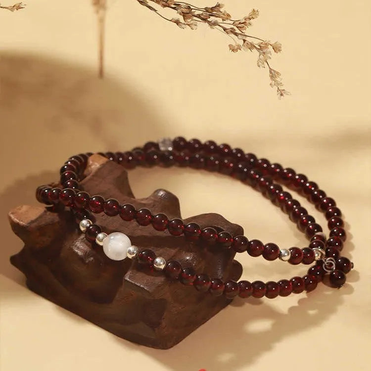 Antique style Chinese bracelet with U-shaped design and floral red garnet imitation gemstones