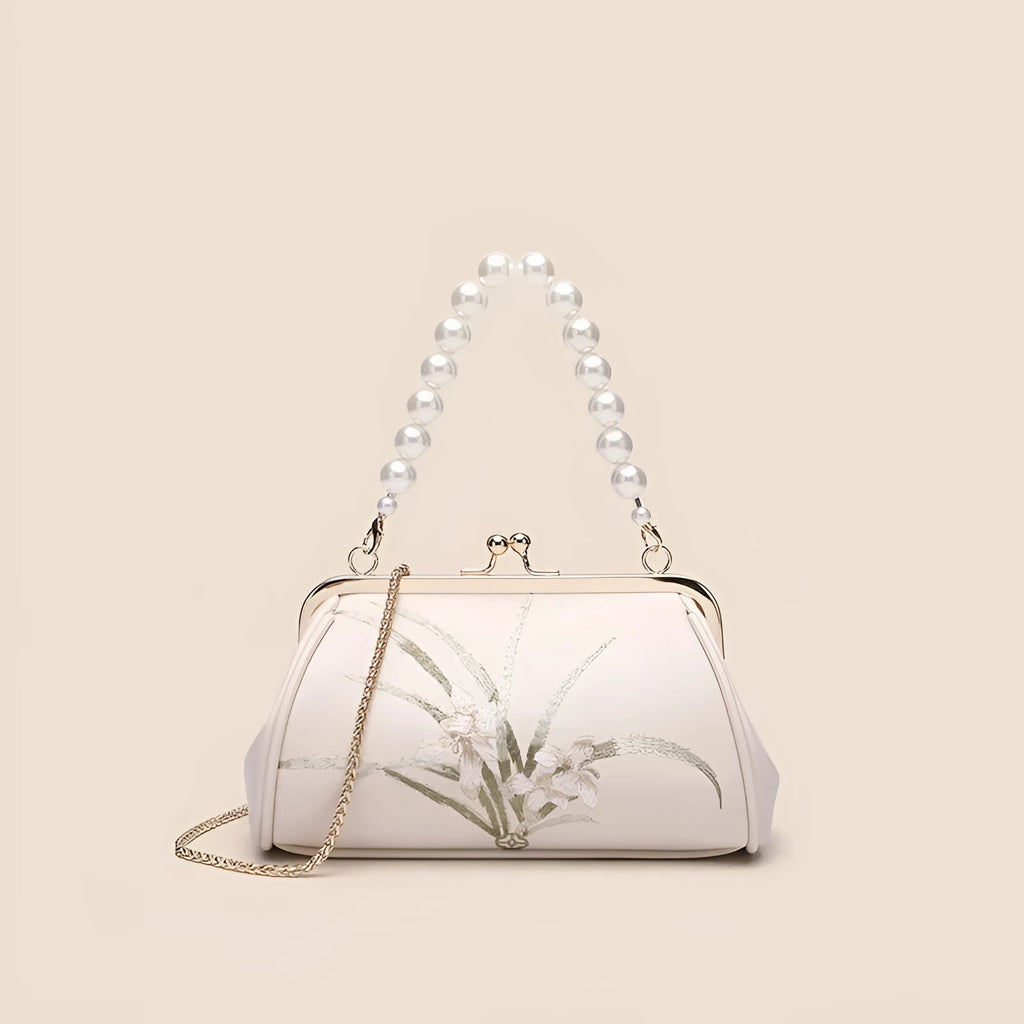 Beige women's embroidered shoulder bag with shell shape design made from soft PU leather