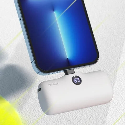 Small cylindrical lipstick tube power bank in purple colour showing digital battery percentage display