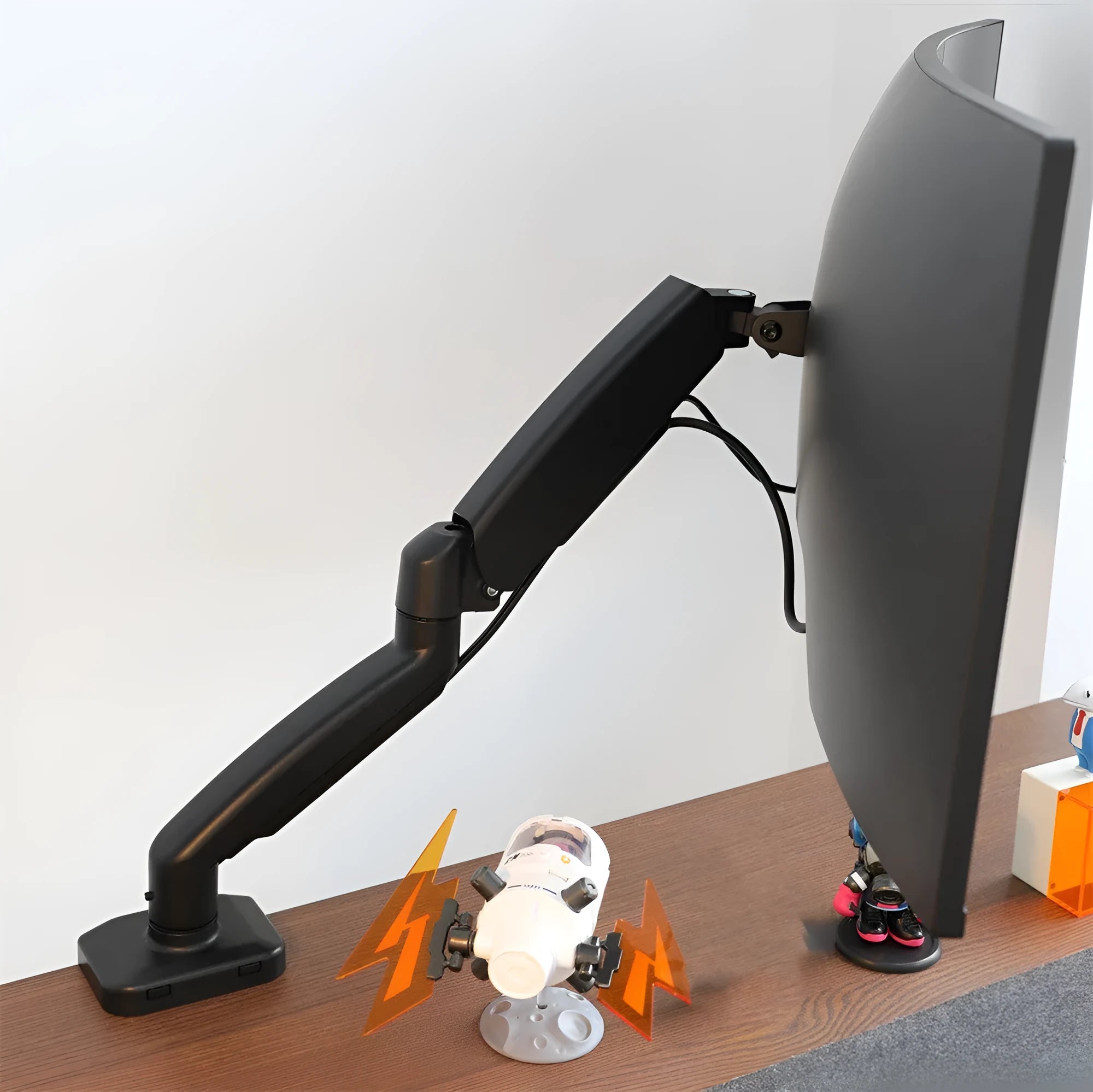 Black rotating telescopic LCD screen bracket elevated on a desk