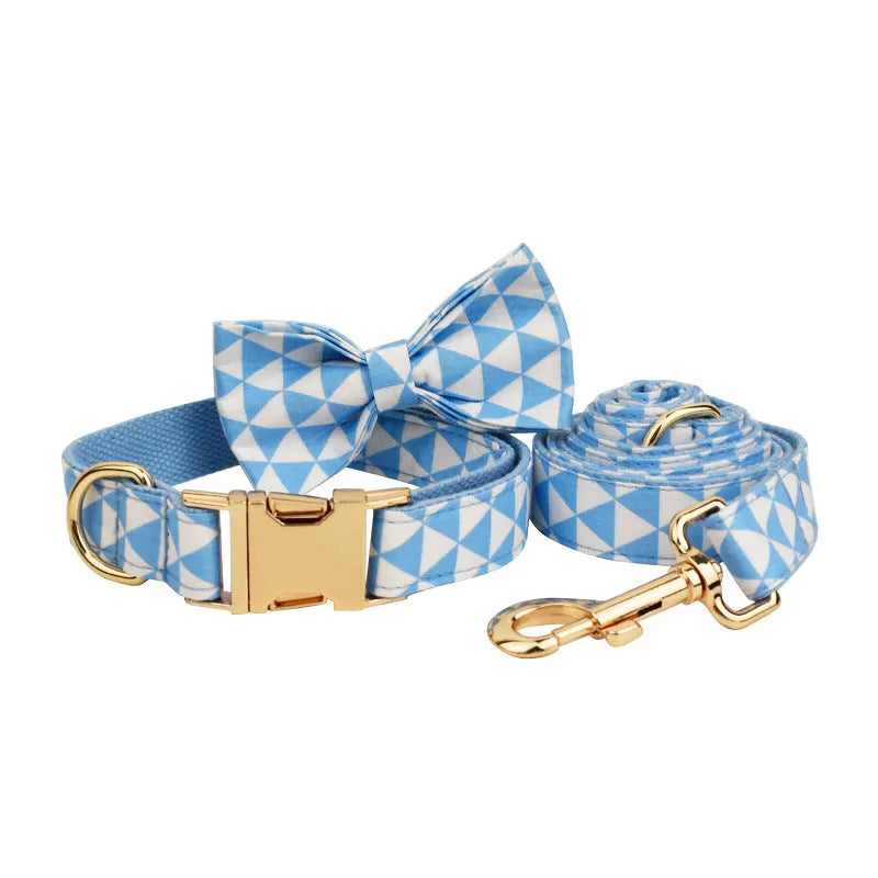 Blue cloth dog vest set with matching collar, rope leash, and bow accessory on dog mannequin